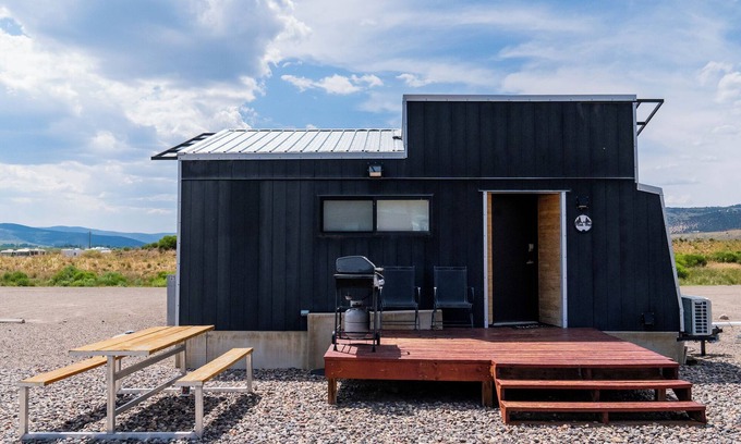 Meeker Haus | This Tiny Home is custom made by a Colorado craftsman has one Queen bed in loft accessible by stairs and also has a fold out Full futon on main level. Sleeps up to 4. Please note, this home does have a sleeping area in a loft. If you require an accom