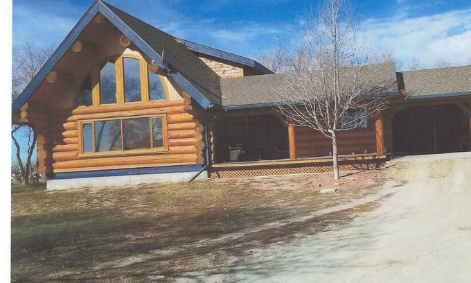 Swift Current Haus | Three level Log Home on Private 40 Acre Estate.