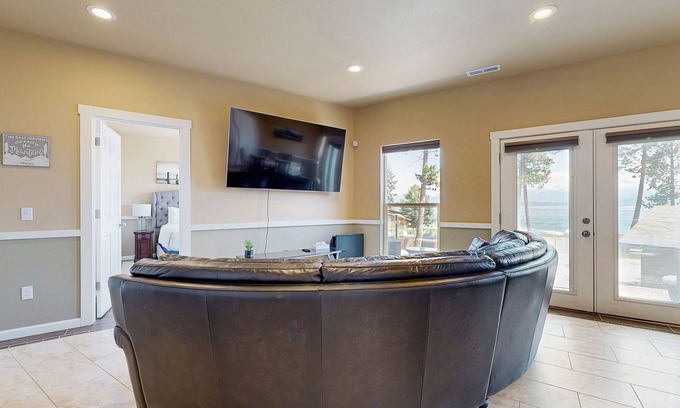 Lakeside Haus | Two-level lakefront home with hot tub access, AC, W/D, & lovely patio