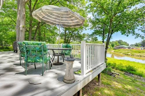 Gladwin Haus | Waterfront Gladwin Home with Deck and Fire Pit!