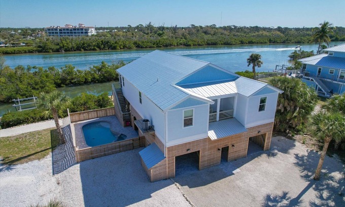 Palm Island Haus | Welcome to the Tipsy Turtle: Luxury 4 bedroom home with Pool and Private Dock on Palm Island