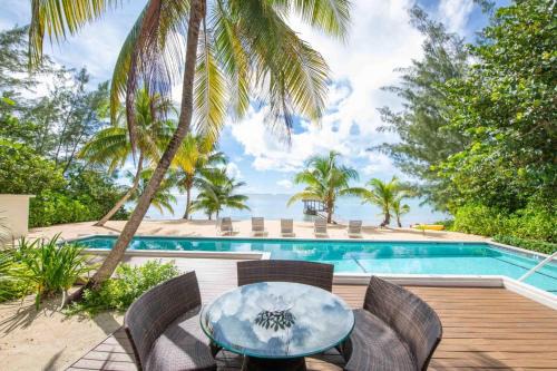 Breakers Haus | White Cottage by Grand Cayman Villas & Condos
