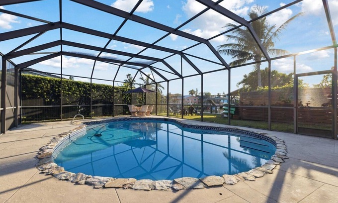 Venetian Way Haus | Your Ultimate Coastal Retreat! Stunning 4-Bed Canal-Front Home w/Pool & Lanai