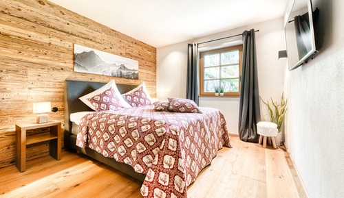 Gartenwohnung in Chalet GM (inkl. Reinigungsgebühr, City Tax & Wäschepaket)