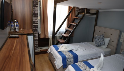 Deluxe-Dreibettzimmer