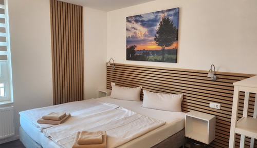 Doppel- oder Zweibettzimmer