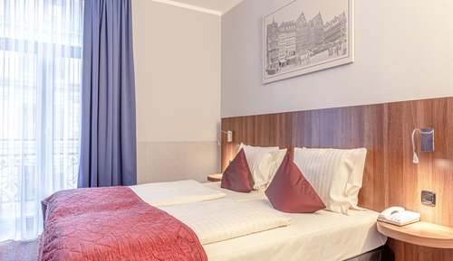 Habitación Confort con 1 cama doble o 2 individuales