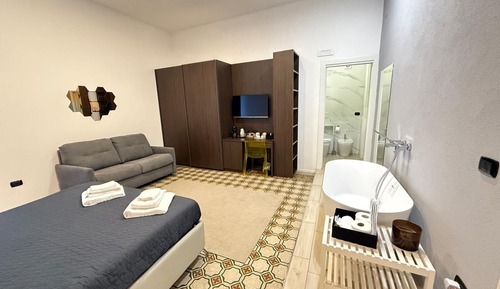 Deluxe-Vierbettzimmer, Balkon, Stadtblick