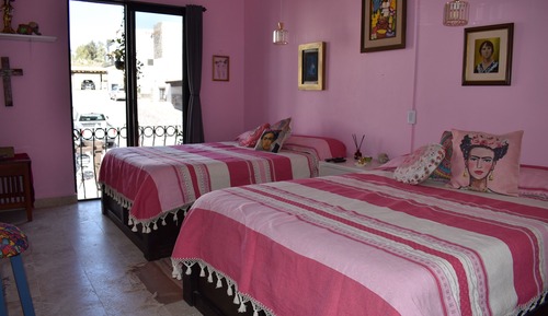 Deluxe room suite with two queen-size beds, beautiful balcony, view, and large shared bathroom