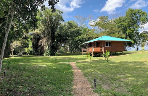 Orange Walk District Kabine | A Cozy cabin along the Rio Bravo River—bird watcher’s paradise with WiFi and AC.