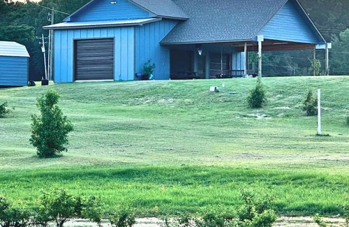 Negreet Haus | RV Cover with entertaining patio and additional storage area at Toledo Bend Lake
