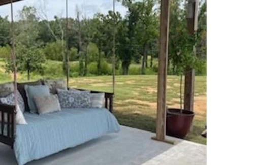 Negreet Haus | RV Cover with entertaining patio and additional storage area at Toledo Bend Lake