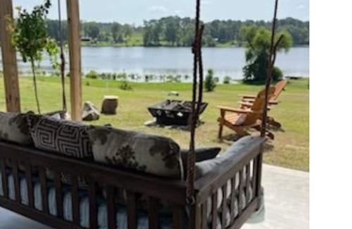 Negreet Haus | RV Cover with entertaining patio and additional storage area at Toledo Bend Lake