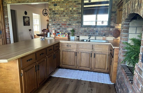 Slocomb Haus | Beautiful large country 3 bedroom home with acreage and ponds.