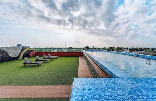 Centro Haus | Experience Serenity in Cozy Room: Rooftop Pool w/Panoramic City Views Await
