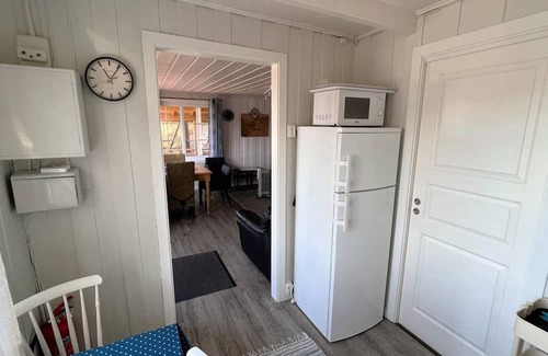 Lindesnes Haus | Holiday home 'Naversund', reduced price, off the island of Furuholmen near Lindesnes in a secluded location with a view of the fjord, Agder, southern Norway, up to 8 people, 4 bedrooms, 2 shower rooms, 2 WC, 50 m² terrace, Internet WIFI, jetty an.