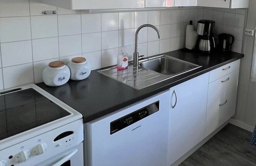 Lindesnes Haus | Holiday home 'Naversund', reduced price, off the island of Furuholmen near Lindesnes in a secluded location with a view of the fjord, Agder, southern Norway, up to 8 people, 4 bedrooms, 2 shower rooms, 2 WC, 50 m² terrace, Internet WIFI, jetty an.
