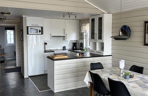 Lindesnes Haus | Holiday home Mona in Lussevika, new addition 2024, near Spangereid-Lindesnes, southern Norway, , max. 6 adults, own boat mooring, approx. 100 m² living space, 3 bedrooms, charming and tasteful furnishings, large veranda with fjord view, terrace f.