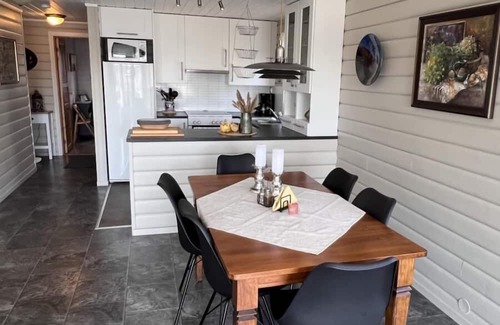 Lindesnes Haus | Holiday home Mona in Lussevika, new addition 2024, near Spangereid-Lindesnes, southern Norway, , max. 6 adults, own boat mooring, approx. 100 m² living space, 3 bedrooms, charming and tasteful furnishings, large veranda with fjord view, terrace f.