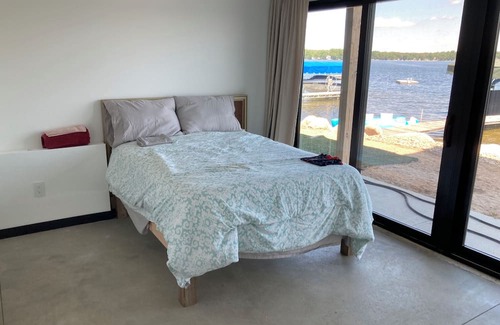 Delton Haus | MODERN & NEW Lake Home w/swimmable beach and built in entertainment