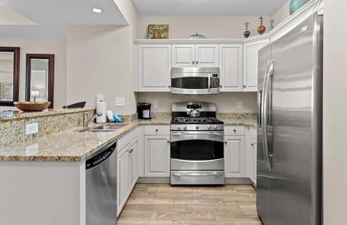 Windy Hill Haus | Aqua Escape: Oceanfront 2BR Condo with King & Queen Beds