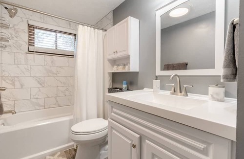 Columbus Haus | Newly remodeled home, spacious deck w/ string lights, & large yard with firepit