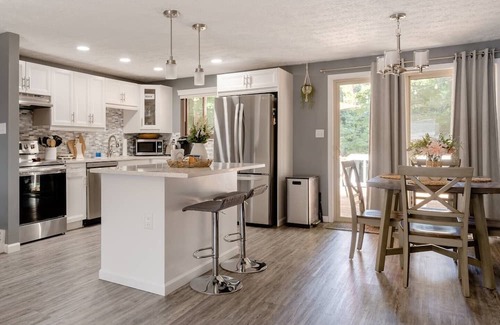 Columbus Haus | Newly remodeled home, spacious deck w/ string lights, & large yard with firepit