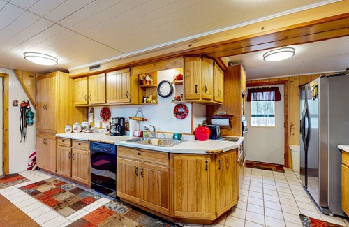 Hazelhurst Haus | Lakefront dog-friendly home with kayaks, rowboat, dock, private lake, & firepit