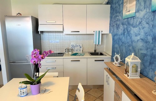 Aprilia Marittima Wohnung | Flat in a colourful residence with pool