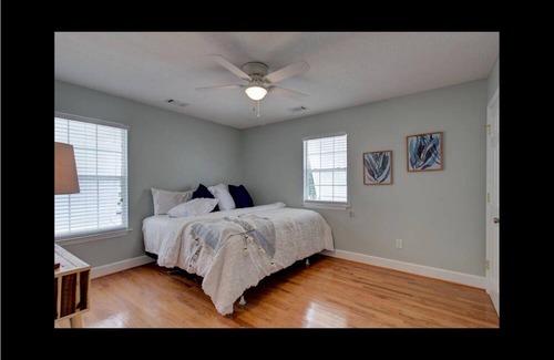 Midway Haus | Waterfront with dock, pool and boat lift, crab traps and paddle boards. Yes-Pets