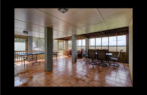 Midway Haus | Waterfront with dock, pool and boat lift, crab traps and paddle boards. Yes-Pets