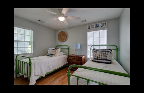 Midway Haus | Waterfront with dock, pool and boat lift, crab traps and paddle boards. Yes-Pets