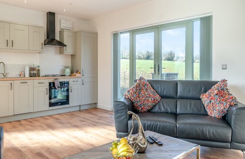 Coed-Y-Paen Hütte | Fox Acre is a stunning lodge with views over the rolling hills, perfect for a relaxing break away or