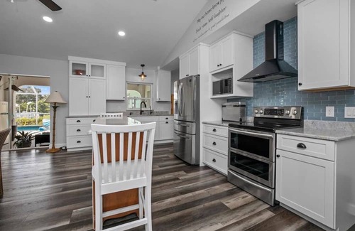 Harbour Heights Haus | Paradise Awaits. Beautiful Home with Pool located on a canal with dock