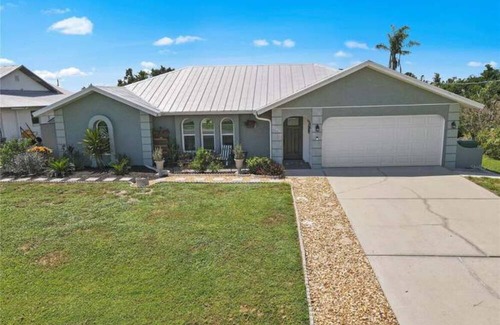 Harbour Heights Haus | Paradise Awaits. Beautiful Home with Pool located on a canal with dock