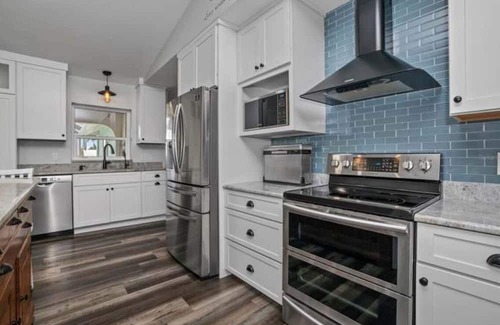 Harbour Heights Haus | Paradise Awaits. Beautiful Home with Pool located on a canal with dock