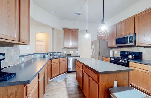 Speyside Haus | Northeast Austin home with enclosed yard, single-story interior, AC, & W/D