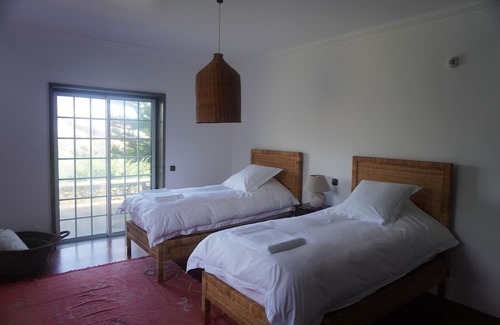 Porto Judeu Haus | Enormous pool and 180 degree ocean view home for 12