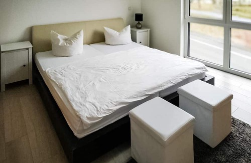 Mehring Wohnung | This modern vacation apartment not far from the Moselle welcomes you with a wonderful view of the co