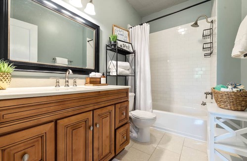 Five Points Haus | Remodeled charmer with work desk, enclosed yard, front porch, & chef's kitchen