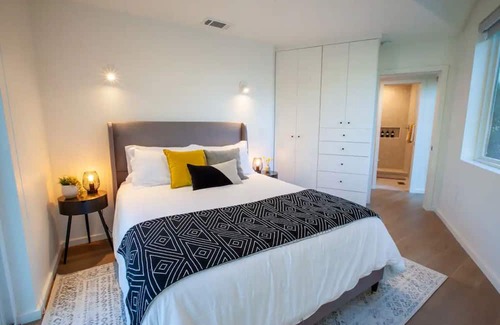 North Loop Haus | Stylish 3 story house. 3 patios. Central Austin.