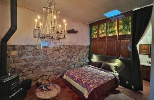 Cerrillos Haus | Romantic, Rock Carriage House, Hot Tub, WoodStove, on Historic Property