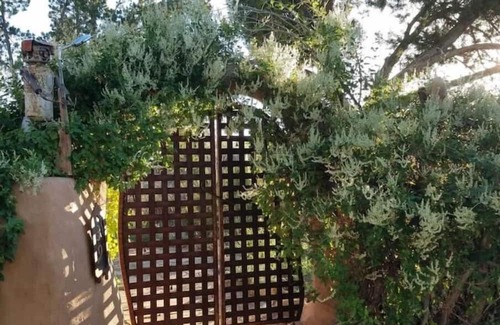 Cerrillos Haus | Romantic, Rock Carriage House, Hot Tub, WoodStove, on Historic Property