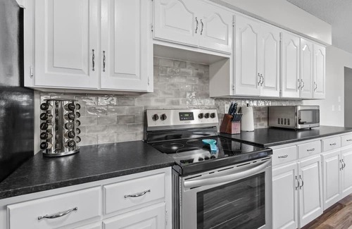 Joplin Haus | Stylish Rancher in Quiet, Tree Lined Neighborhood.
