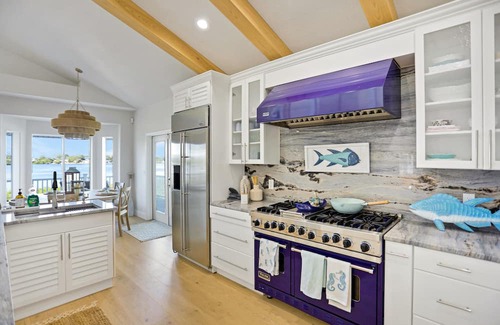 Palm Harbor Haus | Luxurious waterfront home w/pool, hot tub, game room, dock & water activities