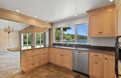 Lakeside Haus | Private Flathead Lake lagoon and dock, enjoy a spacious 5-bedroom Lakeside home.