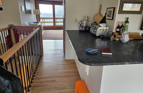 Cragsmoor Haus | A spectacular Shawangunk vista in a beautifully renovated chalet on a lush lawn.