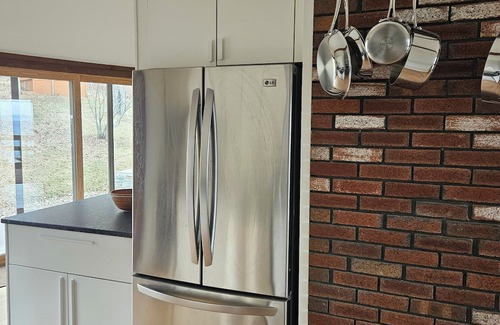 Cragsmoor Haus | A spectacular Shawangunk vista in a beautifully renovated chalet on a lush lawn.