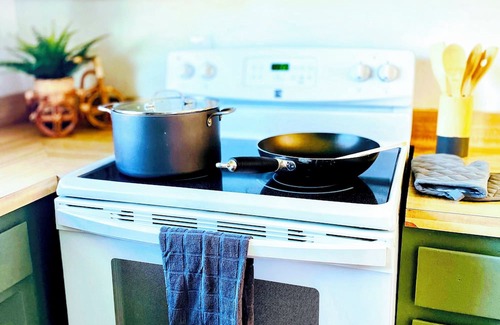 Old Station Haus | Charming 3-bedroom cabin in with AC, spa, game room, firepit & EV charger