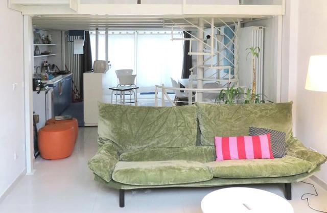 Very bright open space apartment with entire glass wall